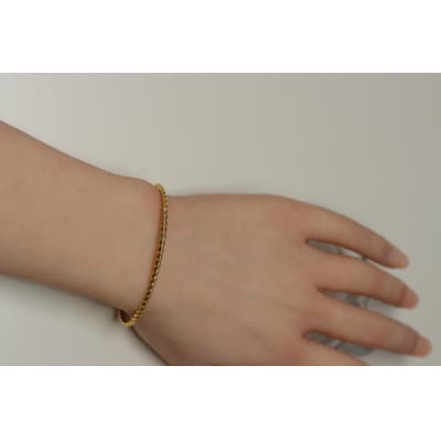 【18金イエローゴールドバングル】動きをデザインする美しいねじれデザイン / KGB18004
